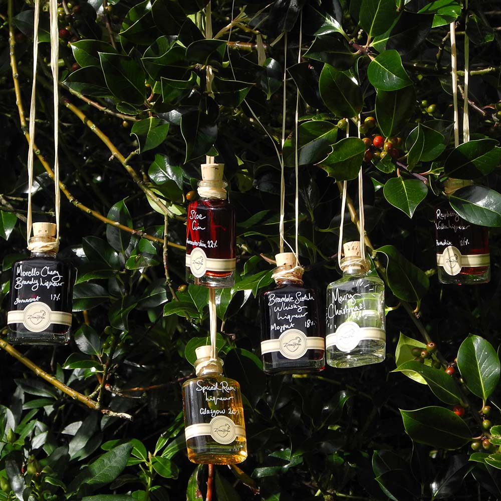 More than Gin Baubles (Set of 6 Liqueur Miniatures) includes Morello Cherry Brandy Liqueur Seville Orange Gin Bramble Scotch Whisky Liqueur Spiced Rum Liqueur Raspberry Vodka Liqueur and Sloe Gin with option for personalised Christmas message