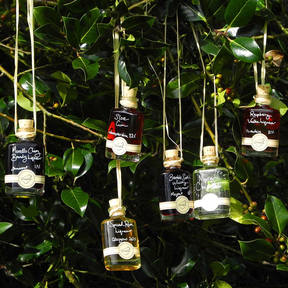 More than Gin Baubles (Set of 6 Liqueur Miniatures) includes Morello Cherry Brandy Liqueur Seville Orange Gin Bramble Scotch Whisky Liqueur Spiced Rum Liqueur Raspberry Vodka Liqueur and Sloe Gin with option for personalised Christmas message
