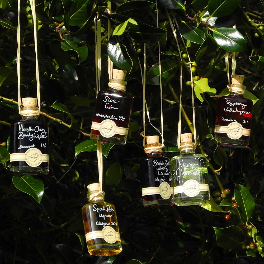 More than Gin Baubles (Set of 6 Liqueur Miniatures) includes Morello Cherry Brandy Liqueur Seville Orange Gin Bramble Scotch Whisky Liqueur Spiced Rum Liqueur Raspberry Vodka Liqueur and Sloe Gin with option for personalised Christmas message