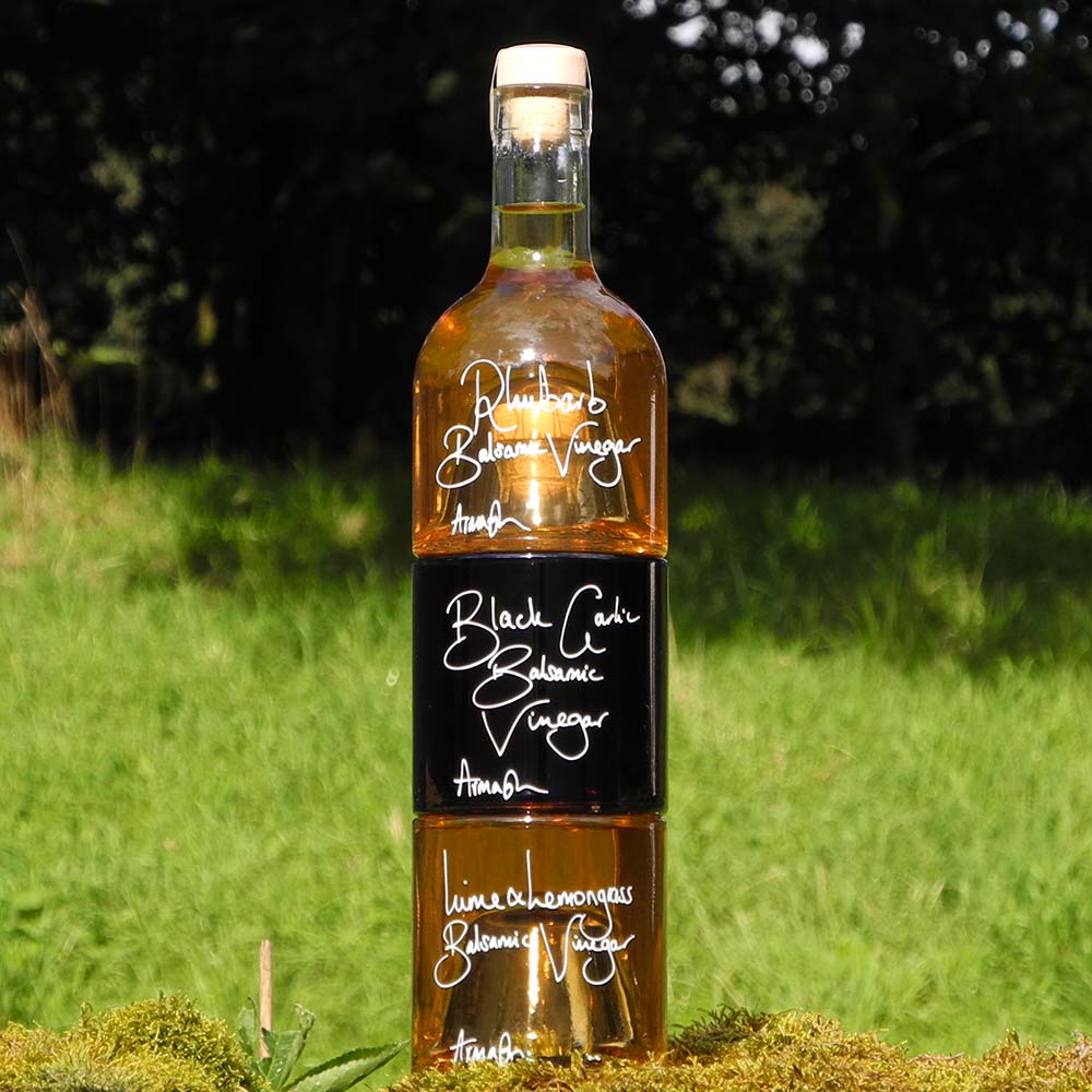 The Balsamic Dressing Gift Set with Rhubarb Balsamic Vinegar, Black Garlic Balsamic Vinegar and Lime and Lemongrass Balsamic Vinegar in stacking bottles.