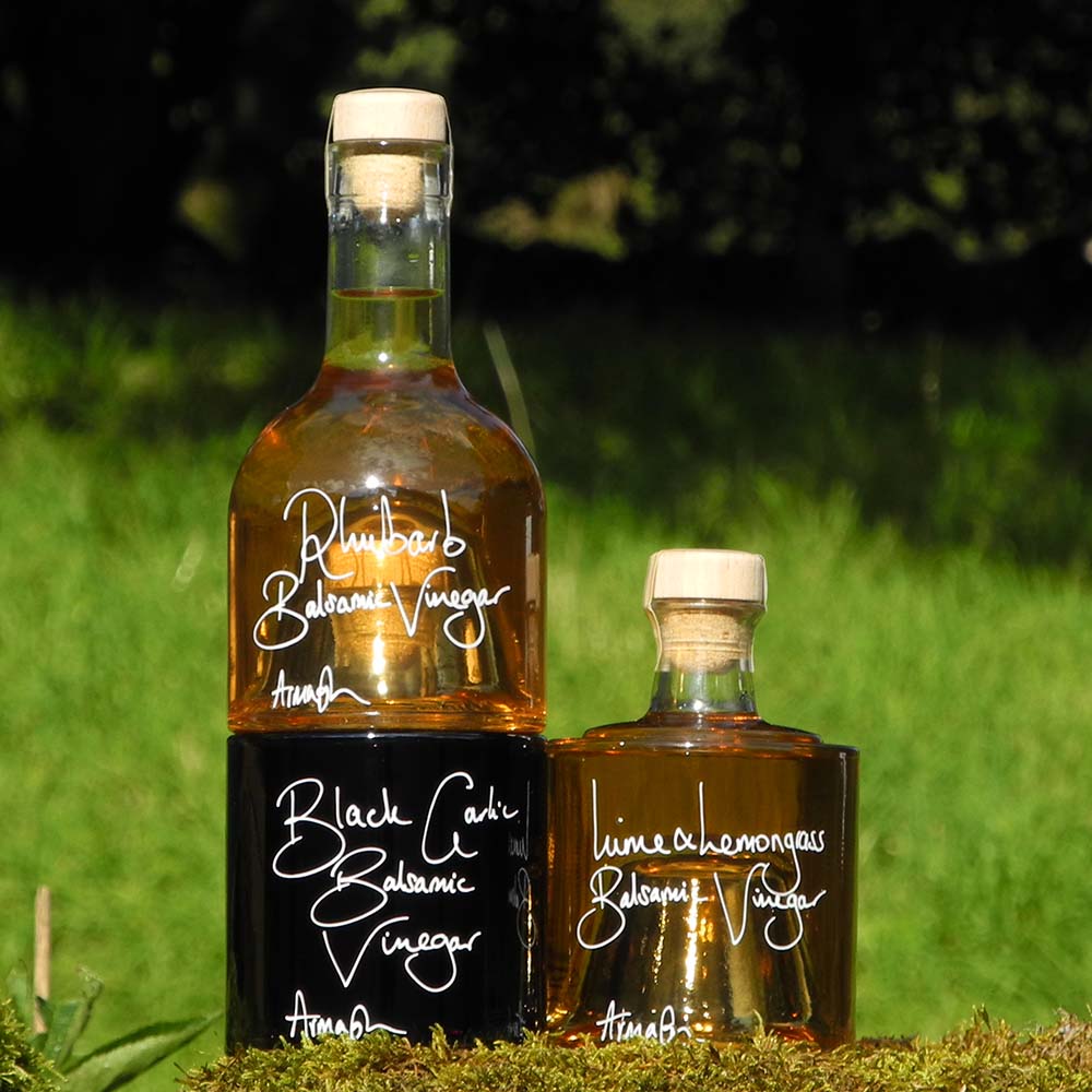 The Balsamic Dressing Gift Set with Rhubarb Balsamic Vinegar, Black Garlic Balsamic Vinegar and Lime and Lemongrass Balsamic Vinegar in stacking bottles.