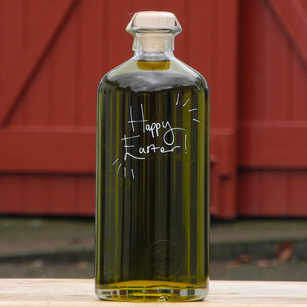 700ml bottle of Ponte de Pedra Extra Virgin Olive Oil from Portugal with handwritten bottle message that says Happy Easter
