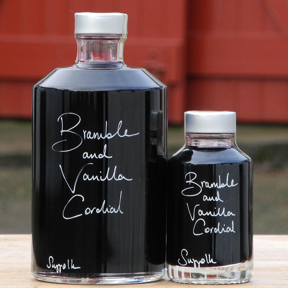 Bramble and Vanilla Cordial in a 500ml bottle and 100ml bottle with handwritten bottle message in white pen.