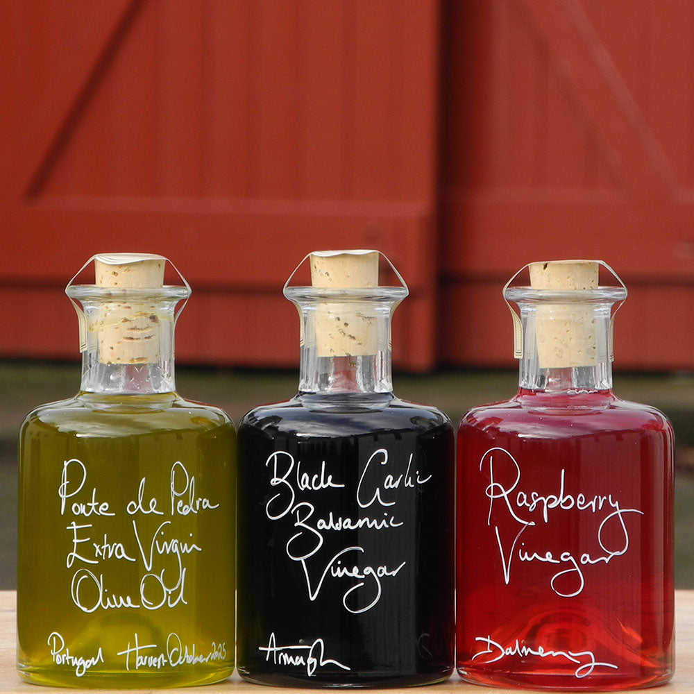 Spring Bread Dipper Set with Portuguese Extra Virgin Olive Oil, Black Garlic Balsamic Vinegar and Raspberry Vinegar in 200ml bottles with handwritten labels in white pen.